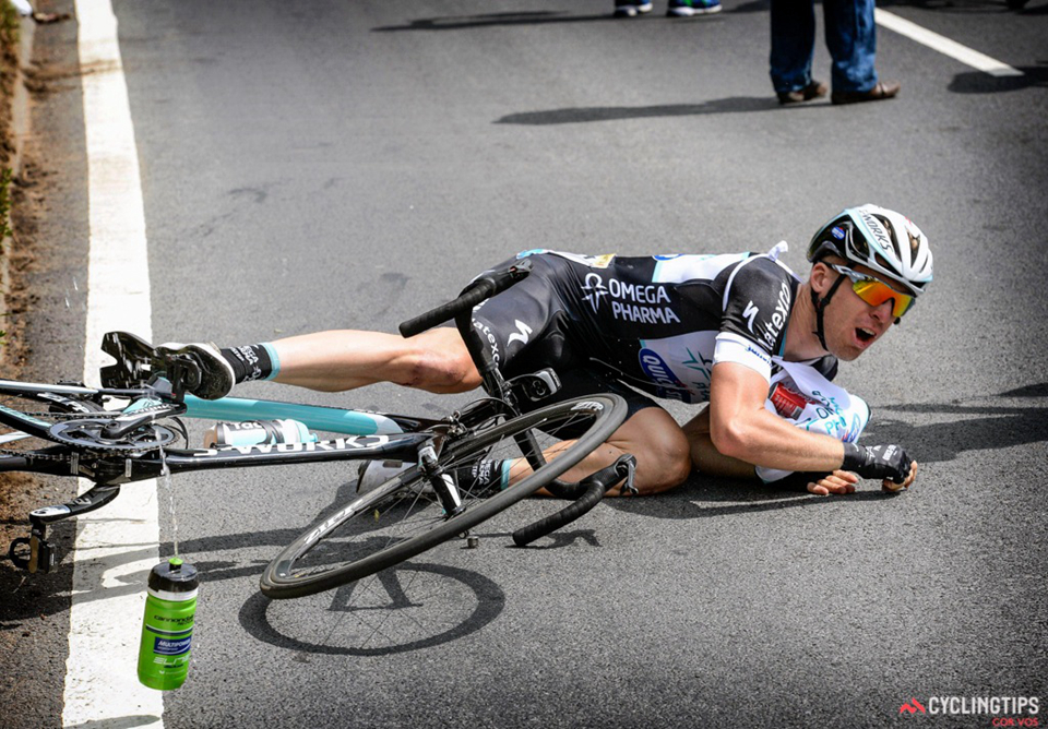 Jan Bakelants takes a tumble while grabbing a feedbag. It was the second crash of the day for the rider who rose to prominence with a win on stage 2 of last years Tour in Corsica.