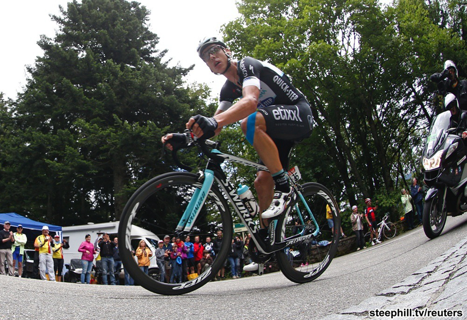 Tony Martin (OPQS) dropped Alessandro De Marchi at the base of the final climb with 59 km to go and preceded with an impressively long individual time-trial with 28 riders hot on his heels
